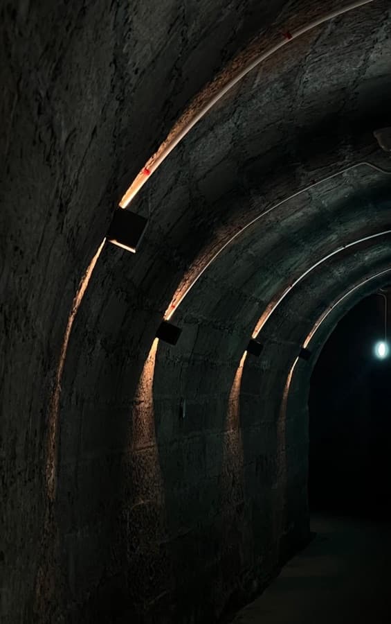 Darerca Chaw — Light along an old stone tunnel
