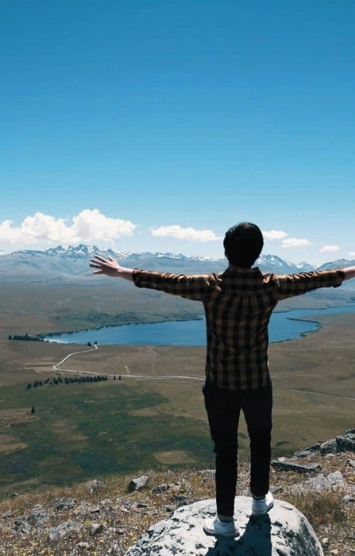 Wilson Lee — Arms wide open on a mountain peak